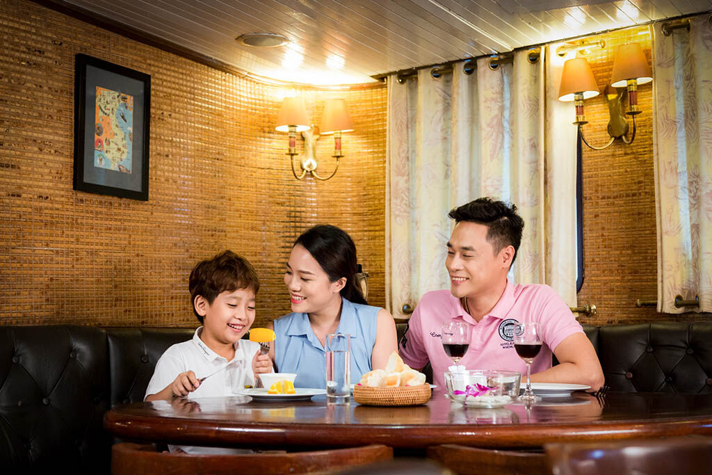 Savor gourmet dining while anchored among Halong Bay’s islands
